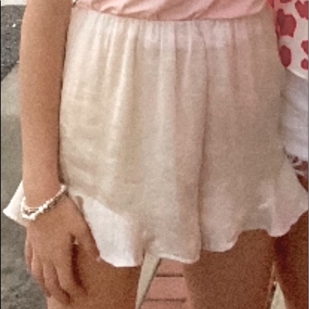 Silk cream shorts with ruffle on the side!